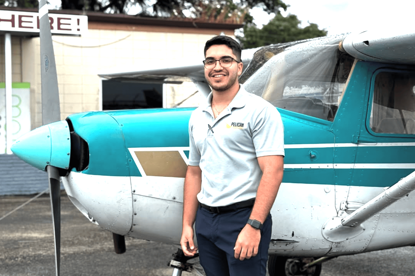 International student pilot near a training airplane at Pelican Flight Training